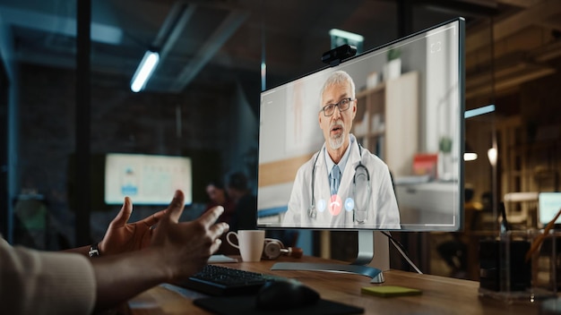 A doctor remotely consulting with a patient via a high-definition video call, with medical data streaming in real-time on a display panel.
