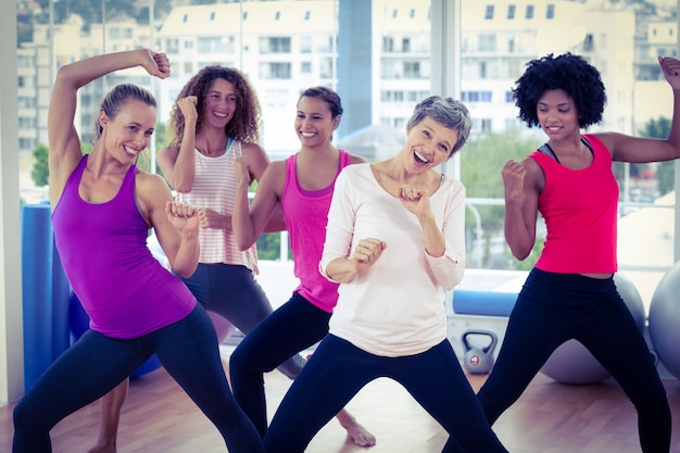 A group of people participating in a Zumba class, showcasing the social and enjoyable aspects of aerobic exercise. The image should evoke a sense of community and fun.