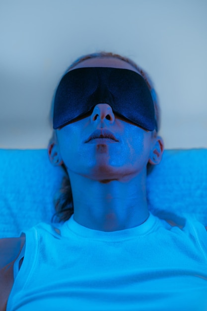 A split image comparing brain activity during sleep with and without blue light blocking glasses, illustrating increased melatonin production and deeper sleep cycles when wearing the glasses, versus suppressed melatonin and disrupted sleep cycles without them.