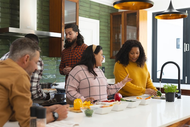 A group of co-living residents participating in a cooking class in a shared kitchen. The atmosphere is lively and collaborative, showcasing the community aspect of co-living.