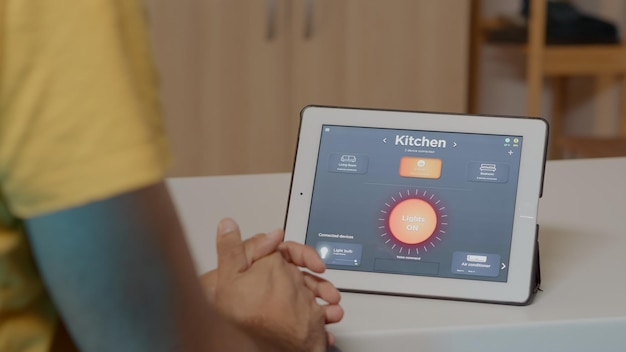 A close-up of a tablet screen displaying a privacy settings dashboard for a smart home security system. The dashboard features options for encrypted data storage, two-factor authentication, and customizable camera recording schedules.