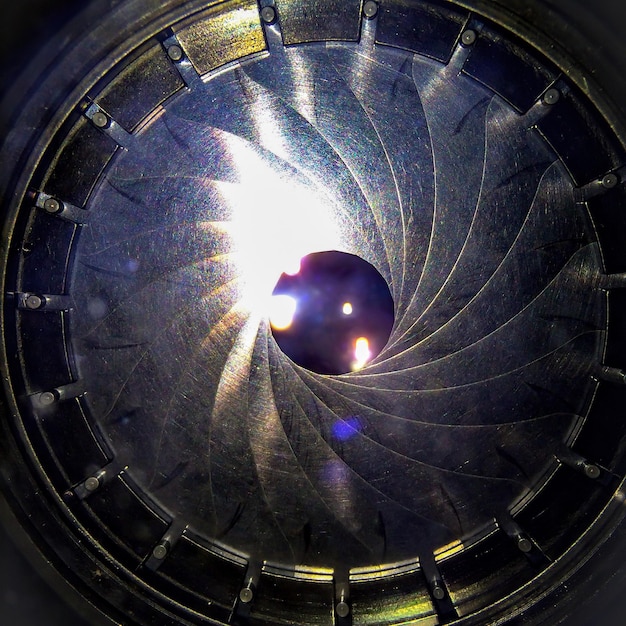 A detailed image of the James Webb Space Telescope in space, showcasing its intricate design and golden mirrors. Focus on the telescope's ability to capture light from distant galaxies.